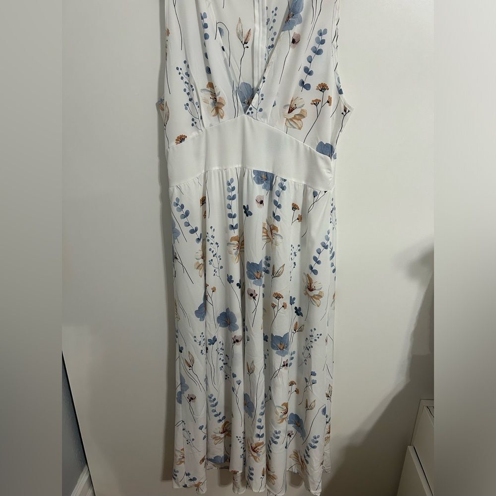 White dress with flowers. Used but in good condition. Size 14